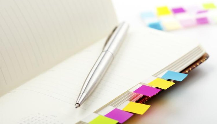 Daily planner with colorful tabs.