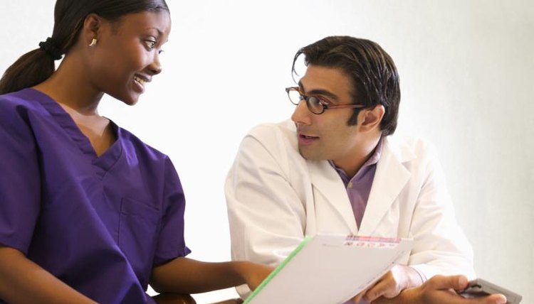 Physician talking with assistant