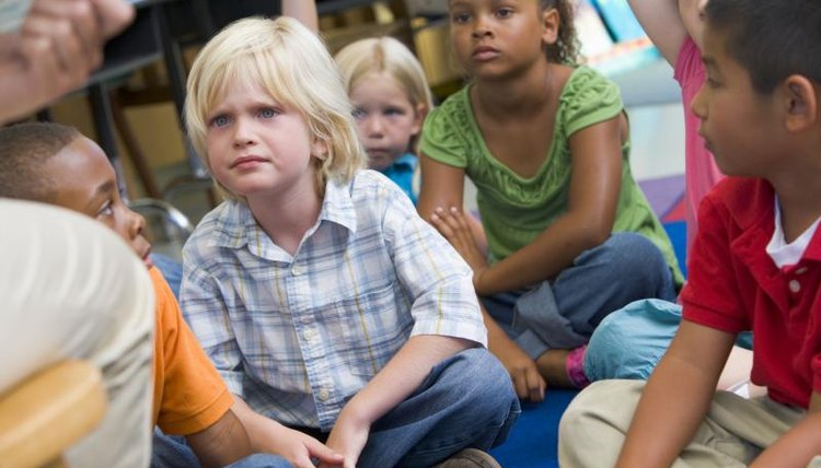 A teacher reads to her class.