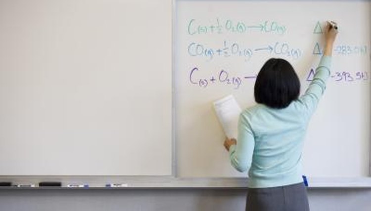 teacher teaching on white board