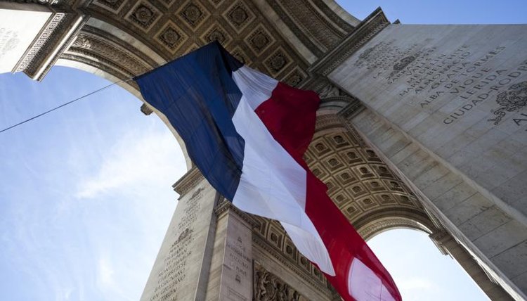 French flag waving during Bastille Day in Paris