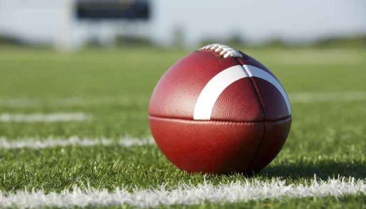 A football lying on a stadium field
