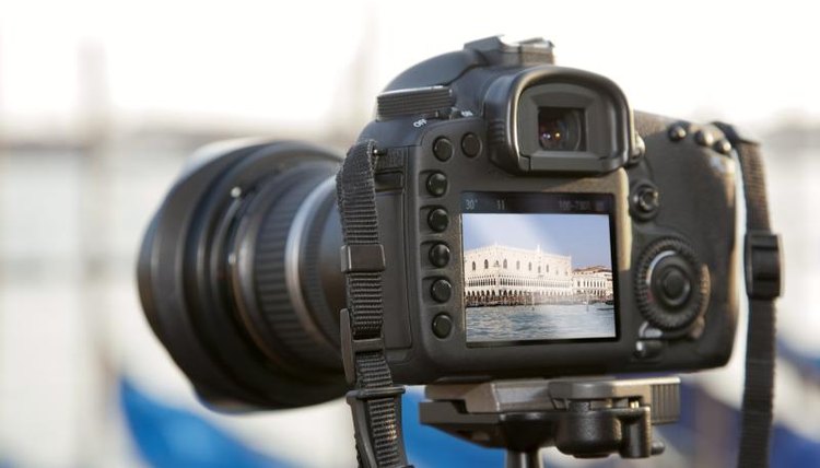 A close-up of a camera pointing at a historic building in Italy..