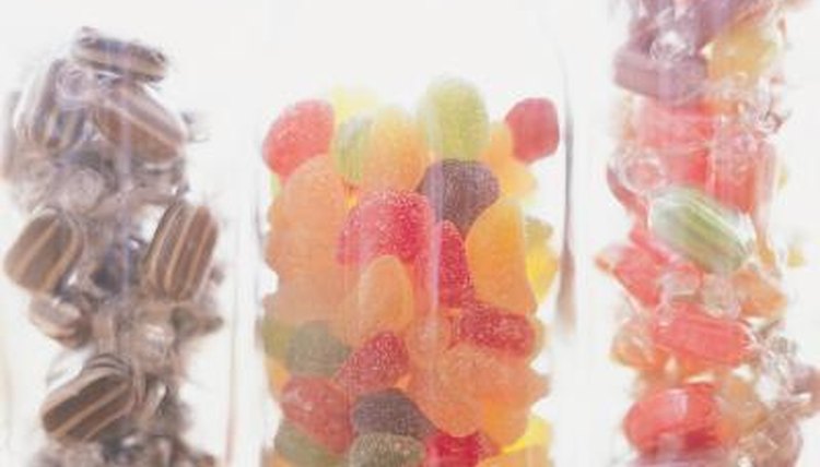 Candy dropped into water and vinegar illustrates human digestion.