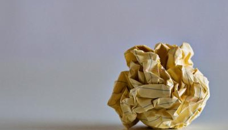 Once you have a stack of papers with questions, begin to create your onion ball.