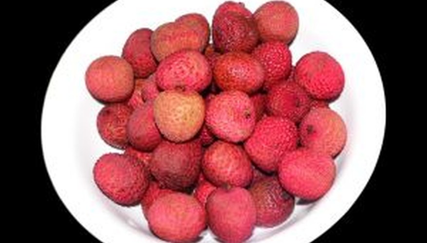 The skins of lychees are peeled before eating. The skins of lychees are peeled before eating.