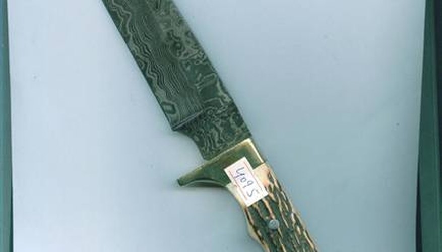 A Damascus Steel Hunting Knife A Damascus Steel Hunting Knife