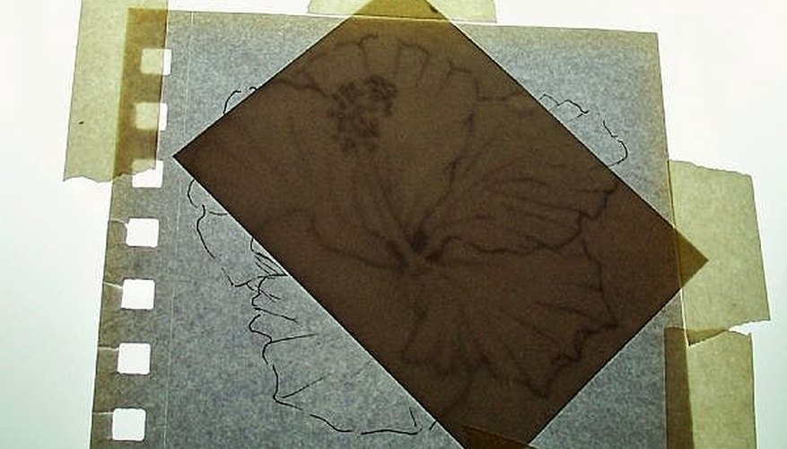 Photo of light box with sketch and watercolor paper taped over it for tracing.