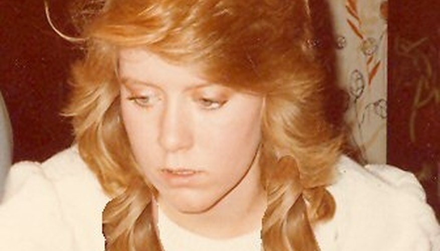 Beginning to add long hair strands from the hair mass on the right side of the face.