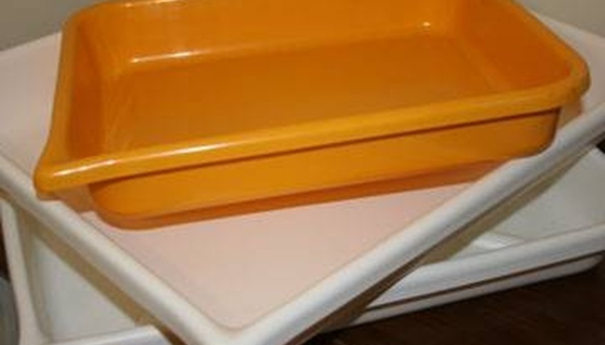 Trays for chemicals to process paper