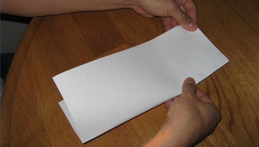 Fold the paper vertically. Fold the paper vertically.