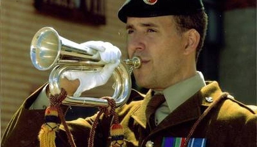 A bugle major plays at a ceremony A bugle major plays at a ceremony