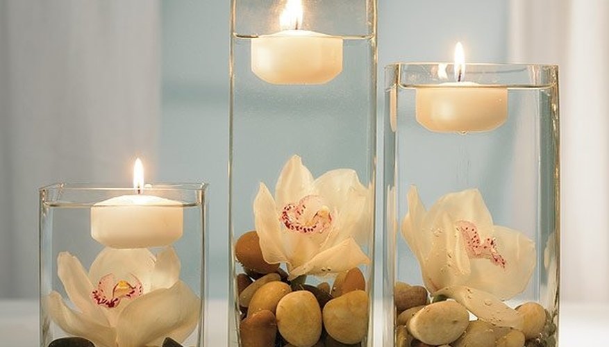 Candles, stone and vases help in creating beautiful outdoor wedding table decorations Candles, stone and vases help in creating beautiful outdoor wedding table decorations