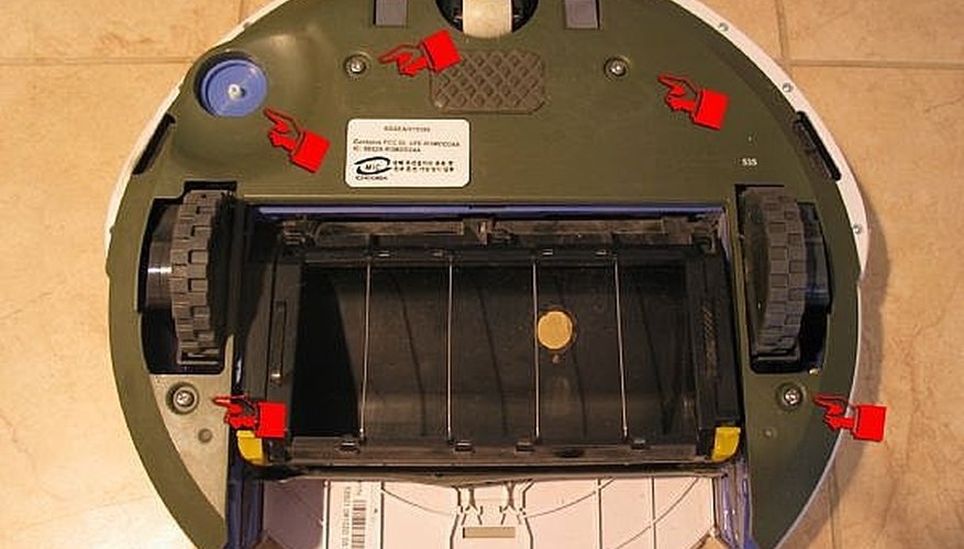 Open bottom cover and remove spinning brush
