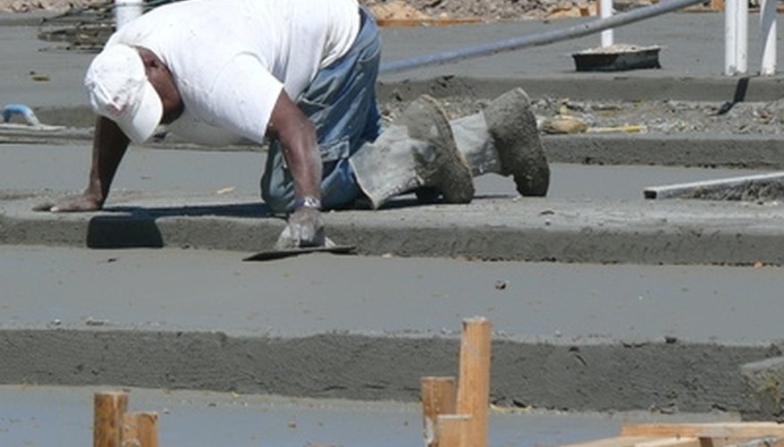 Anchor bolts are often cast into wet concrete slabs for attaching walls and fixtures later. Anchor bolts are often cast into wet concrete slabs for attaching walls and fixtures later.