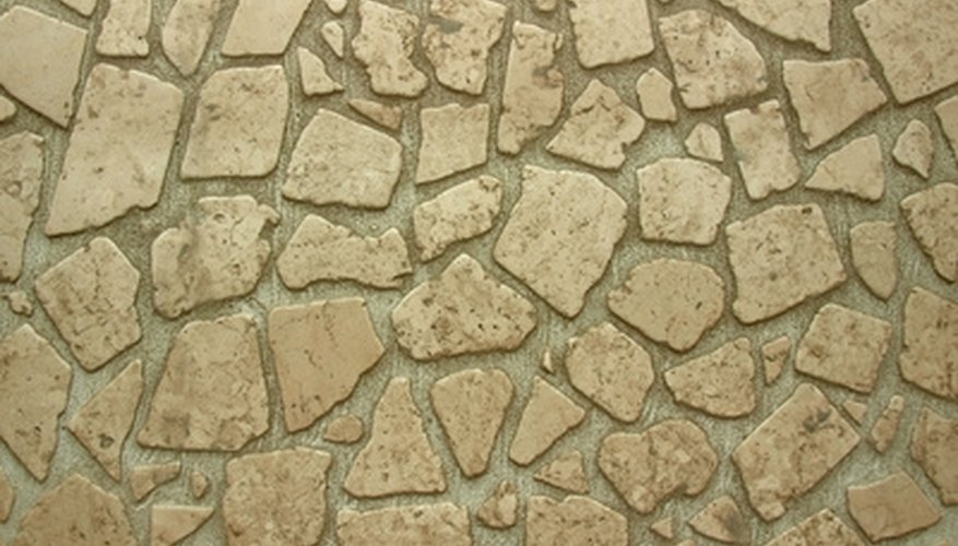 Natural flagstones are used to create a strong and stable driveway surface. Natural flagstones are used to create a strong and stable driveway surface.