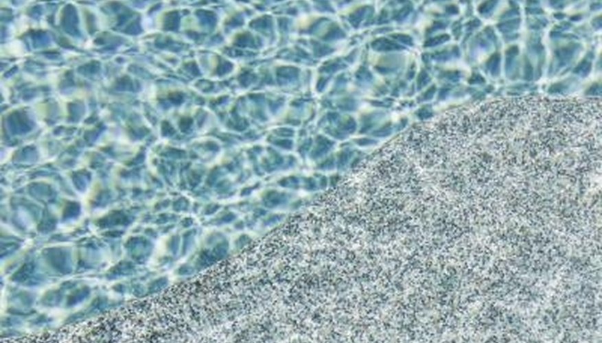 Add chemicals to your pool skimmer to preserve water clarity. Add chemicals to your pool skimmer to preserve water clarity.