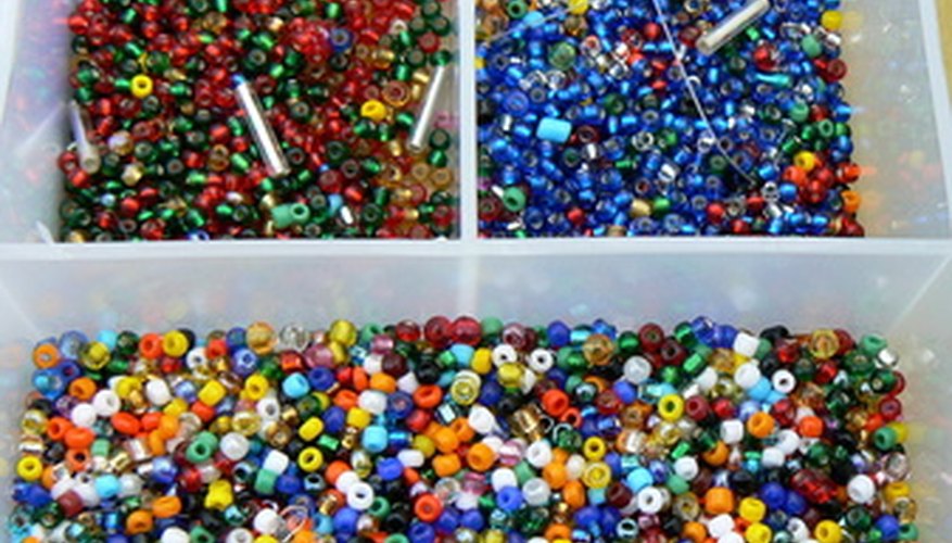 Photo Credit: beads image by Alison Bowden from <a href='http://www.fotolia.com'>Fotolia.com</a> Make a flat spiral bracelet out of coloful beads.