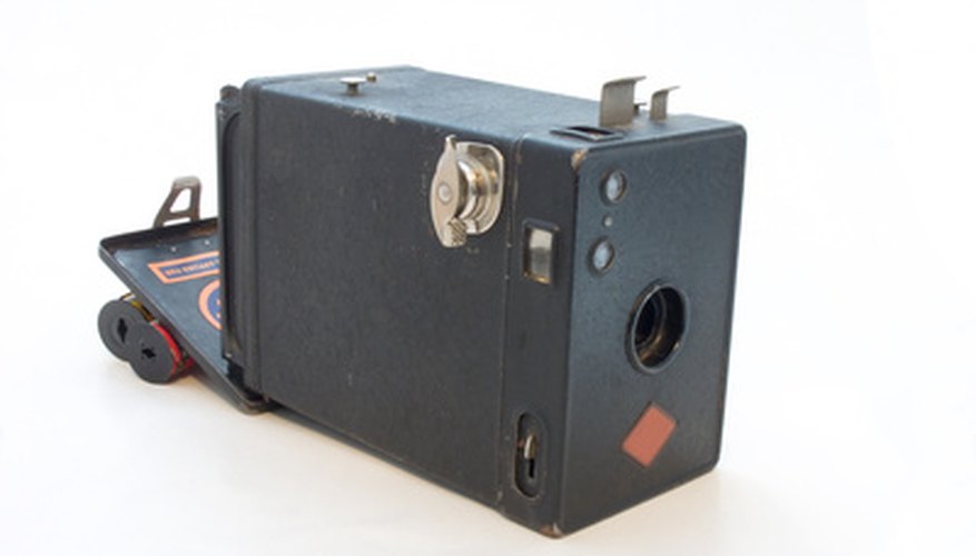 In 1900, the average family could take pictures with a boxlike camera called the “Brownie.” In 1900, the average family could take pictures with a boxlike camera called the “Brownie.”