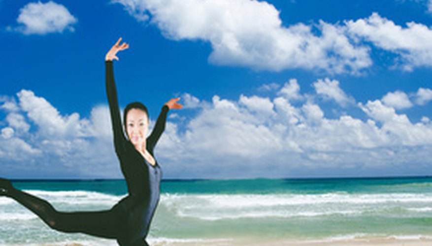 Photo Credit: ballet at beach image by chinatiger from <a href='http://www.fotolia.com'>Fotolia.com</a> Ballet leaps require great strength.