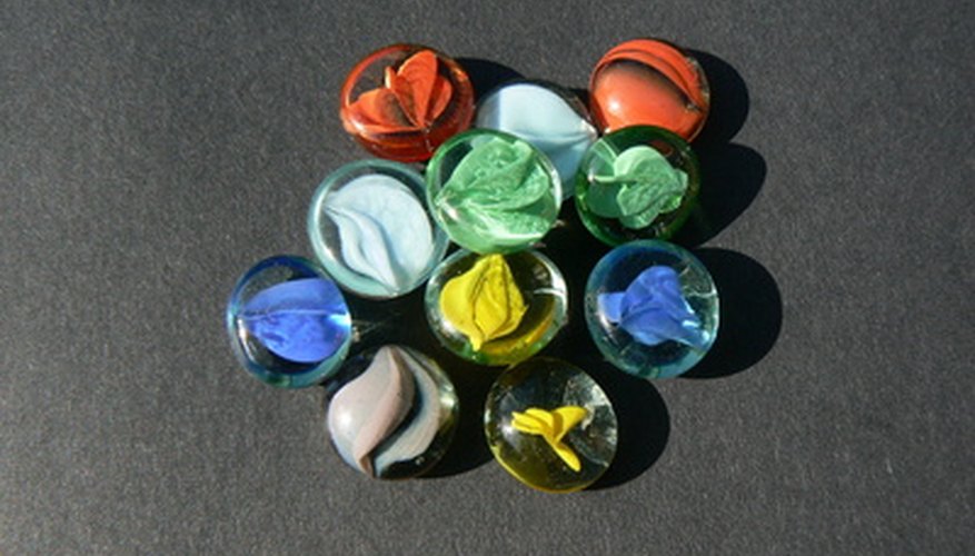 Photo Credit: mancala beads image by Alison Bowden from <a href='http://www.fotolia.com'>Fotolia.com</a> Mancala Marbles