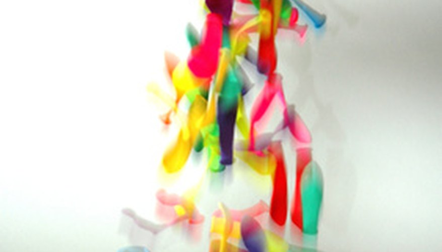 Photo Credit: balloons and hand image by Warren Millar from <a href='http://www.fotolia.com'>Fotolia.com</a> Blow up balloons.