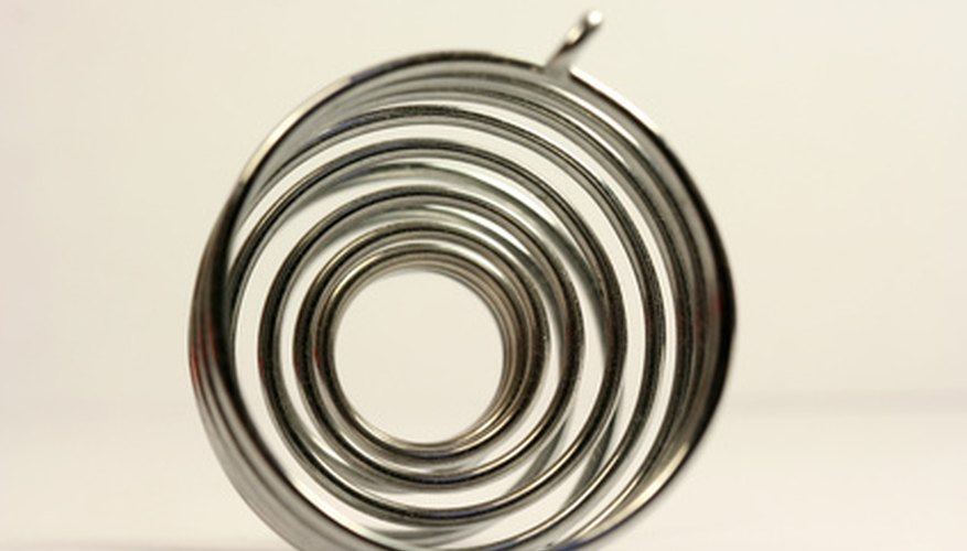 Photo Credit: spiral image by Vaida from <a href='http://www.fotolia.com'>Fotolia.com</a> A tapered spiral of wire can be the base for a decorative wind spinner.