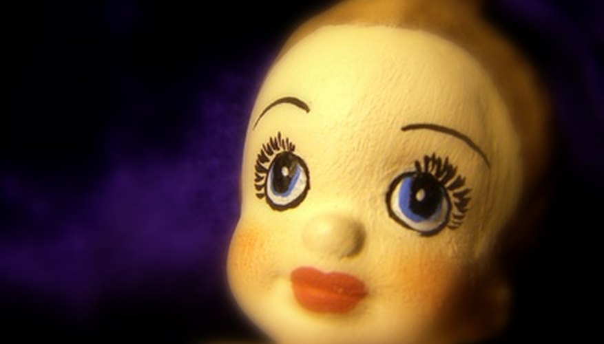 Photo Credit: doll face image by robert mobley from <a href='http://www.fotolia.com'>Fotolia.com</a> Faces can be simplistic or complex depending on your skill level.