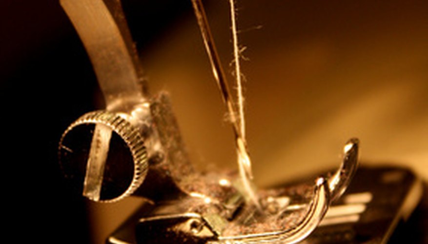 Photo Credit: Sewing Machine Needle image by C Agoncillo from <a href='http://www.fotolia.com'>Fotolia.com</a> Troubleshoot sewing machine problems to keep on sewing.