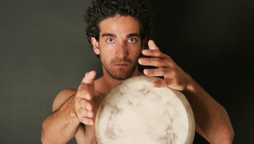 Photo Credit: Drum player image by MAXFX from <a href='http://www.fotolia.com'>Fotolia.com</a> The lively music of the tambora is steeped deeply in tradition.