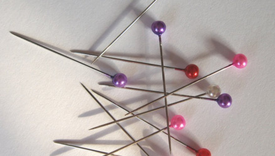 Straight pins with pearl heads are easier to remove as you sew. Straight pins with pearl heads are easier to remove as you sew.