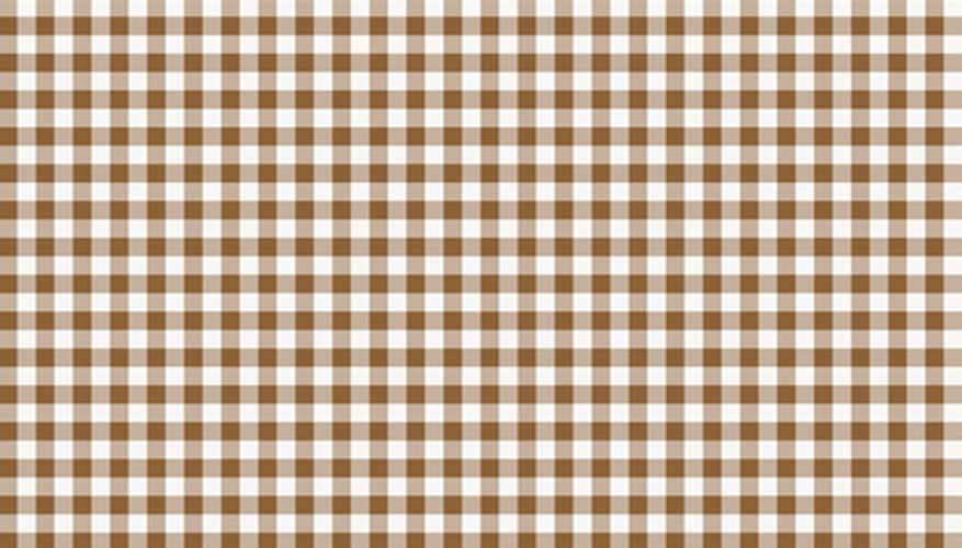 Chicken scratch is embroidered on gingham fabric. Chicken scratch is embroidered on gingham fabric.