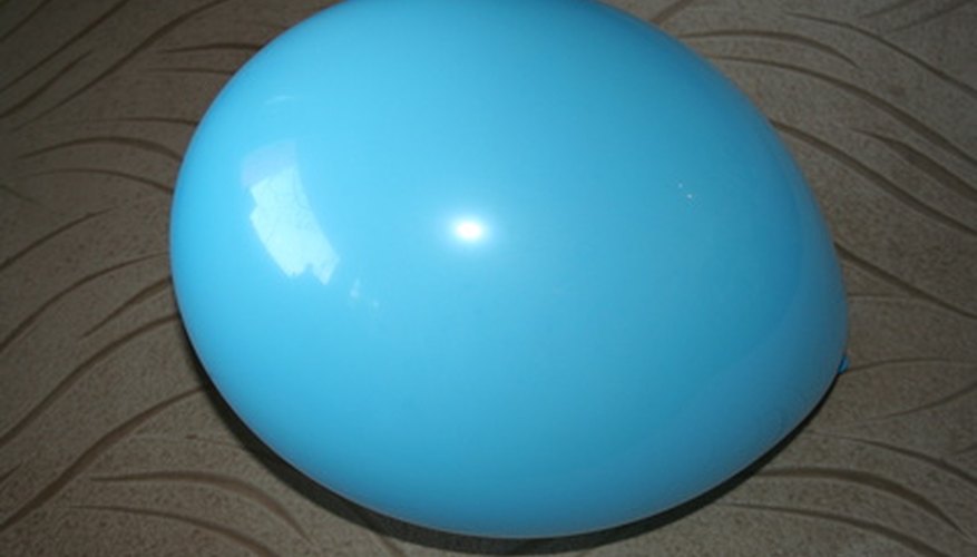 Photo Credit: blue balloon image by Vita Vanaga from <a href='http://www.fotolia.com'>Fotolia.com</a> Balloon Ball is a good game for the end of a meeting or during a break.