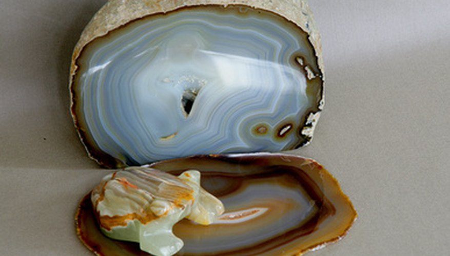 Photo Credit: nature morte avec agate 3 image by Mikhail Blajenov from <a href='http://www.fotolia.com'>Fotolia.com</a> Agates reflect light more than other rocks.