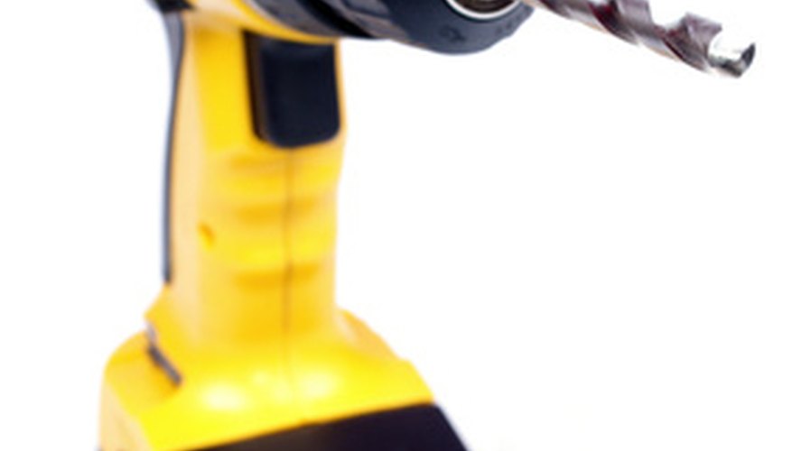 DeWalt cordless drill with a twist bit in the chuck. DeWalt cordless drill with a twist bit in the chuck.