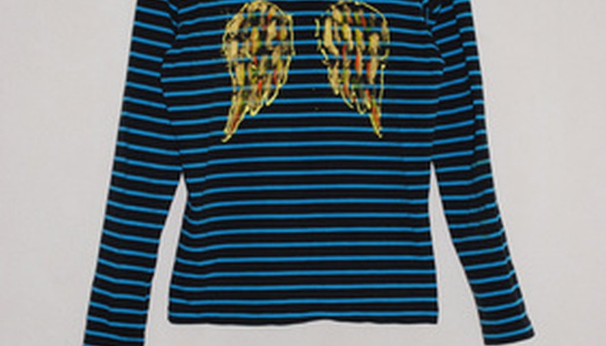 Add some angel wings to a plain shirt with a transfer pencil and fabric paint. Add some angel wings to a plain shirt with a transfer pencil and fabric paint.