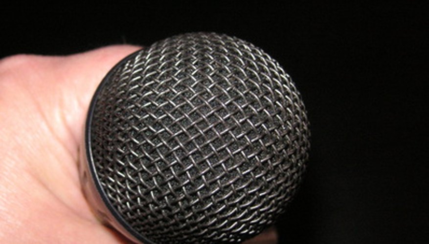 Photo Credit: microphone in hand image by leafy from <a href='http://www.fotolia.com'>Fotolia.com</a> Take to the microphone