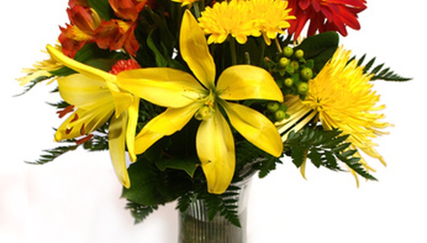 Lilies, carnations and roses figure in church flower arrangements. Lilies, carnations and roses figure in church flower arrangements.
