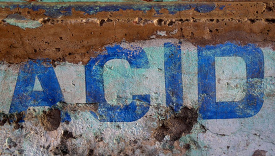 Photo Credit: acid image by charles taylor from <a href='http://www.fotolia.com'>Fotolia.com</a> Use caution when handling Nitric Acid