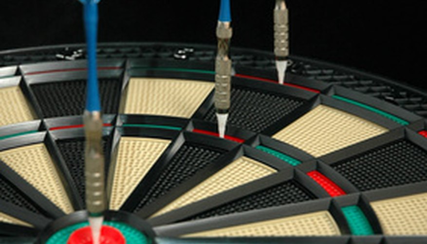 Photo Credit: darts 150 image by Warren Millar from <a href='http://www.fotolia.com'>Fotolia.com</a> Only the outer double ring and the inner bull will allow scoring to begin.