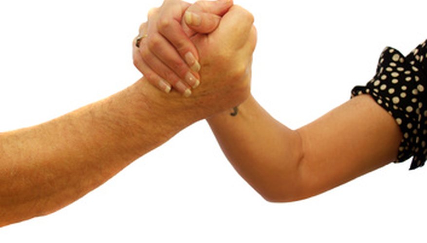 Photo Credit: arm wrestling image by Peter Baxter from <a href='http://www.fotolia.com'>Fotolia.com</a>
