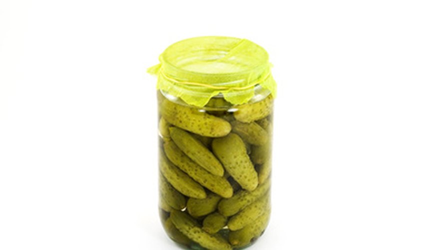 Photo Credit: pickles image by dinostock from <a href='http://www.fotolia.com'>Fotolia.com</a> Stoneware was often sealed with bladders, cloth or leather