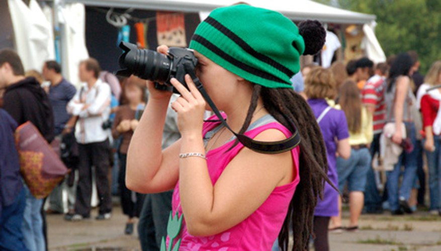 Photo Credit: photographer in a crowd image by Daria Miroshnikova from <a href='http://www.fotolia.com'>Fotolia.com</a> Some scavenger hunt lists require taking pictures.