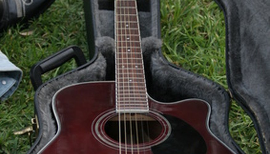 Photo Credit: guitar image by Earl Robbins from <a href='http://www.fotolia.com'>Fotolia.com</a> Throughout history, the guitar has been a dominant sound in pop recordings.