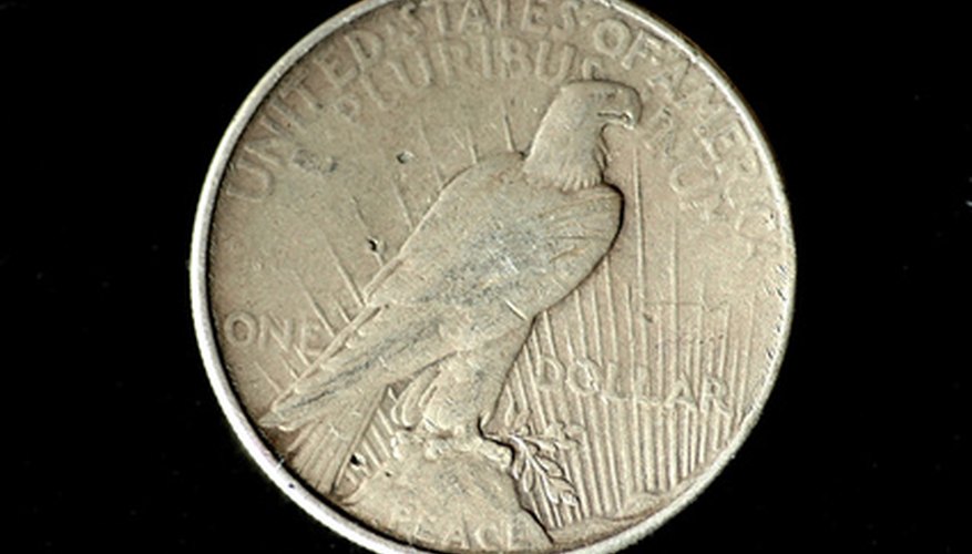 The reverse side of a Peace Dollar, showing the word "Peace" near the lower rim. The reverse side of a Peace Dollar, showing the word "Peace" near the lower rim.