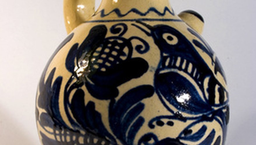 Photo Credit: Traditional Korond earthenware image by BiroZsolt from <a href='http://www.fotolia.com'>Fotolia.com</a> Birds and flowers were common designs