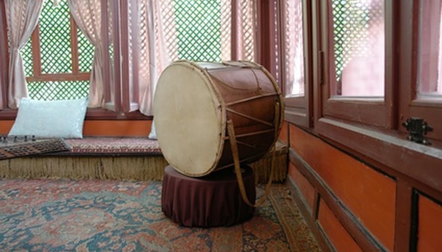 Photo Credit: ancient drum image by Stepanov from <a href='http://www.fotolia.com'>Fotolia.com</a> Several different styles of tambora drums have emerged, but the engaging feel of the rhythms remains.