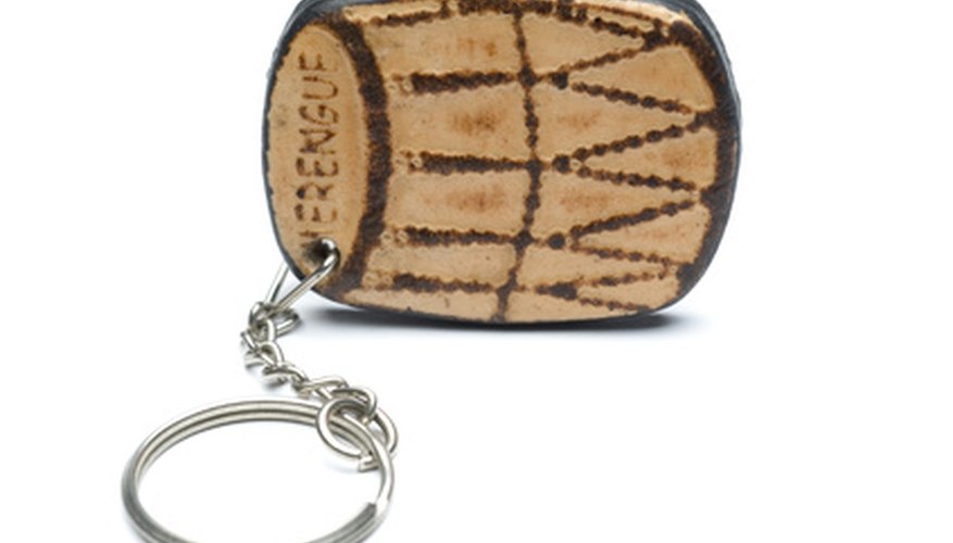 Photo Credit: key chain souvenir dominican republic image by robert lerich from <a href='http://www.fotolia.com'>Fotolia.com</a> Merengue music and the tambora are a strong part of the culture of the Dominican Republic.