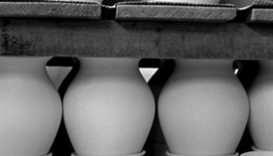 Photo Credit: poteries image by daniel sainthorant from <a href='http://www.fotolia.com'>Fotolia.com</a> Stoneware from molds isn't as valuable as handcrafted work