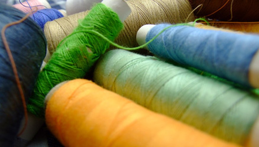 Photo Credit: yarn macoooo image by .shock from <a href='http://www.fotolia.com'>Fotolia.com</a> Wool yarn comes in many colors and thicknesses. Choose a thickness that will best suit the type of decoration you will apply.